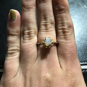 18K GE Opal Oval Cushion. Size 5.5